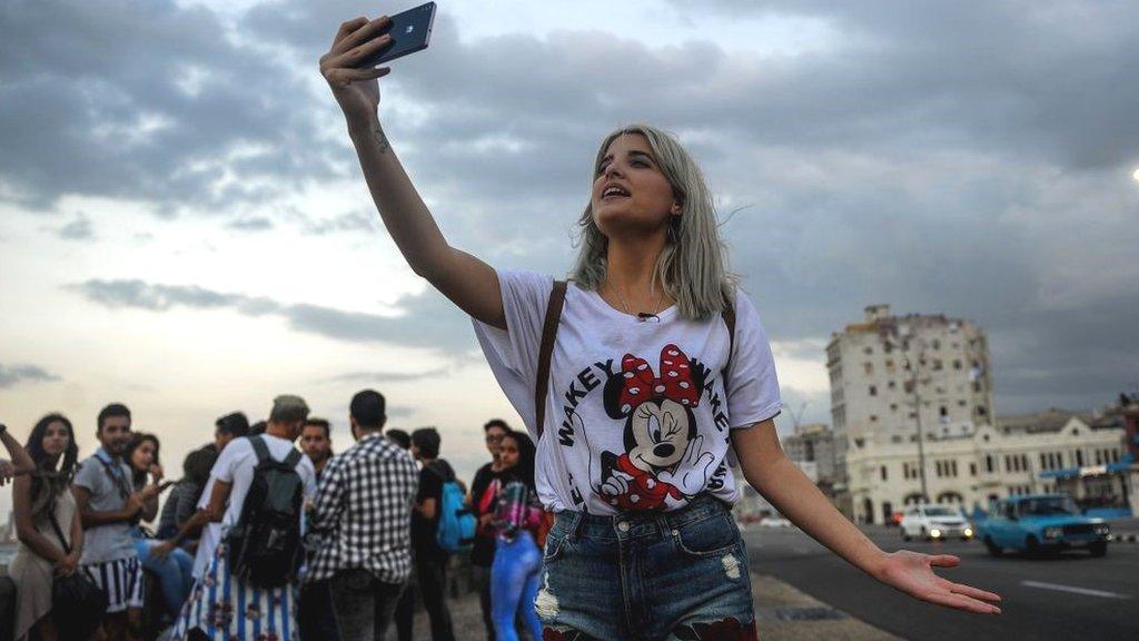 Cuban woman on phone