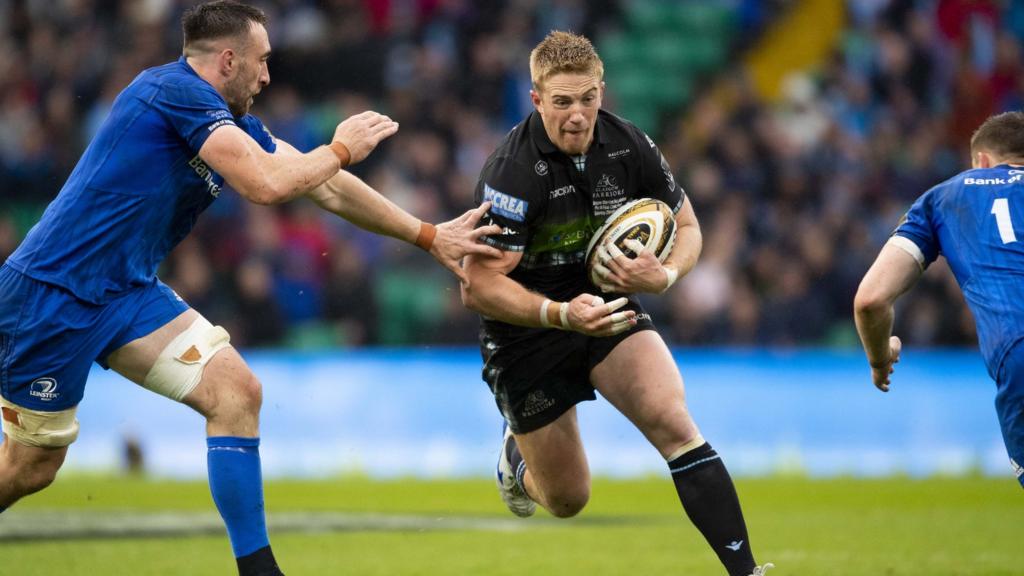 Warriors’ Kyle Steyn takes on Leinster’s Jack Conan and Garry Ringrose