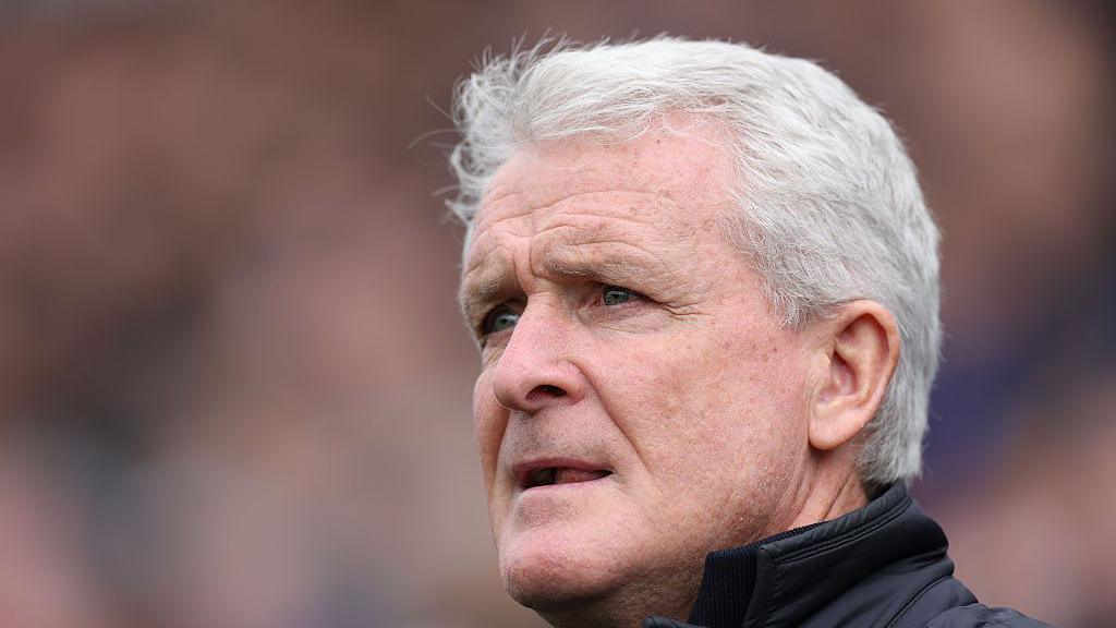 Mark Hughes watching Carlisle play