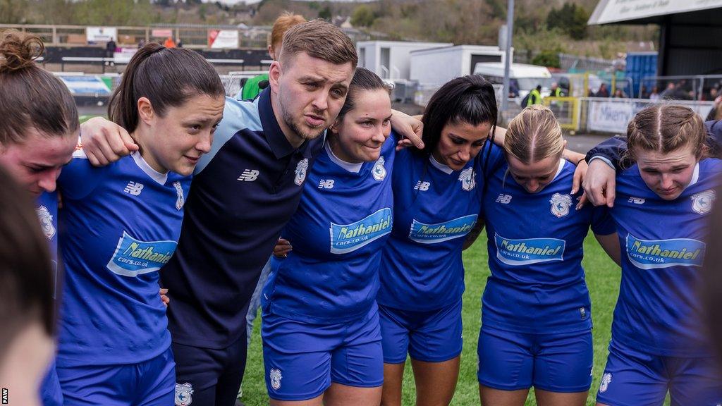 Cardiff City Women manager Iain Darbyshire and his players huddle together