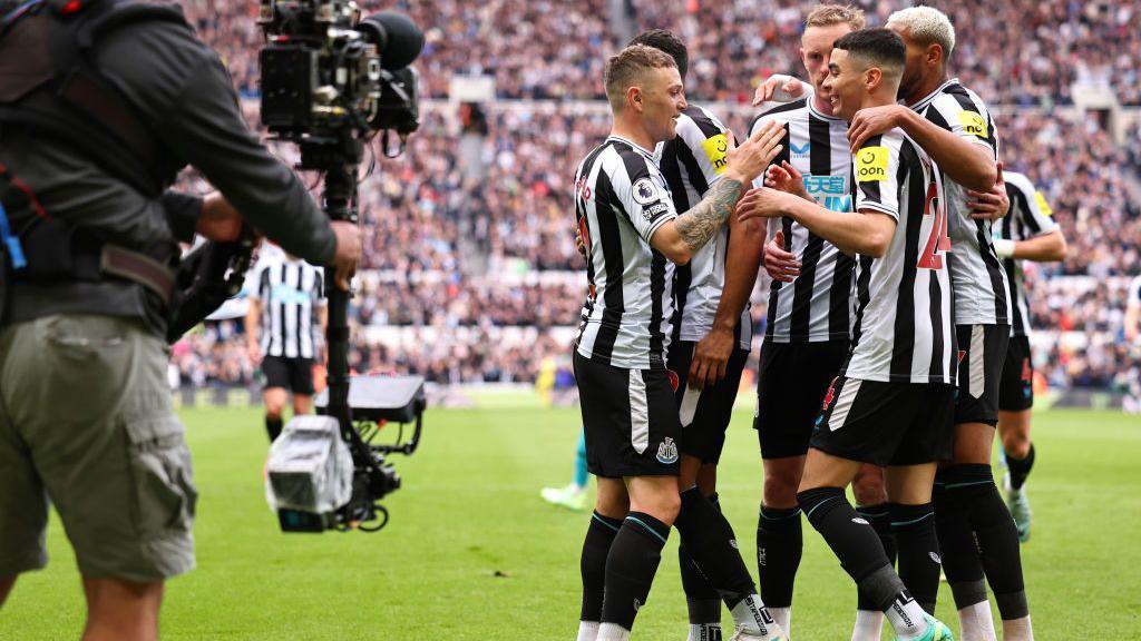 Newcastle United fans and players celebrating a memorable moment at St James' Park