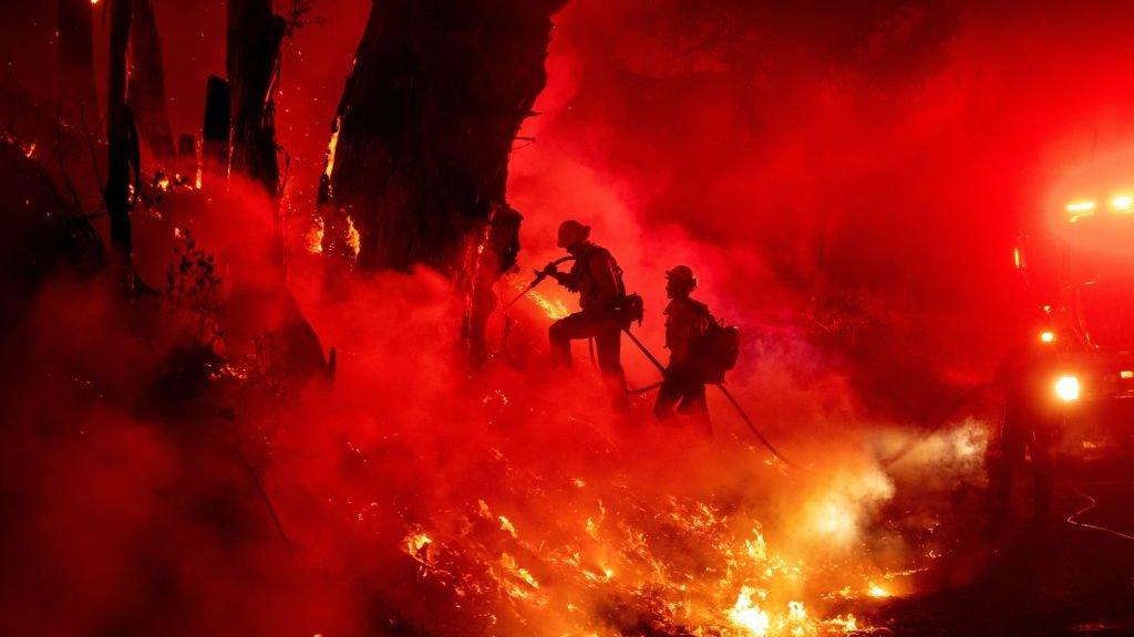 Firefighters work to control flames from a backfire during the Maria fire in Santa Paula, California on 1 November