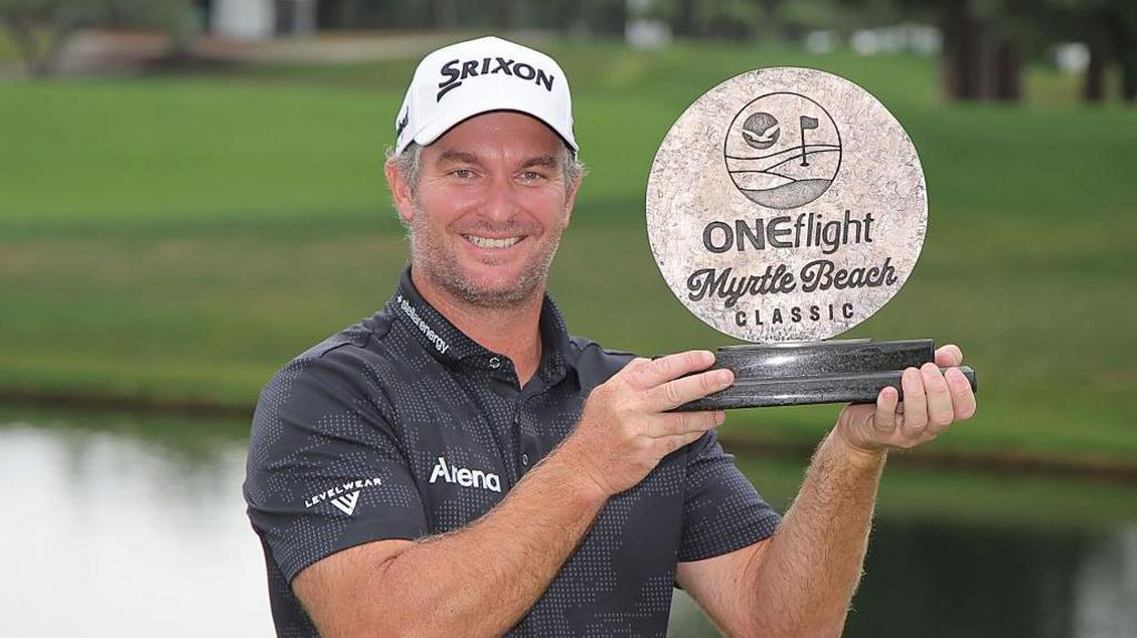 Ryan Fox celebrates with the winner's trophy