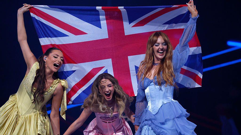 Remember Monday representing United Kingdom walk on stage during the Grand Final of the 69th Eurovision Song Contest