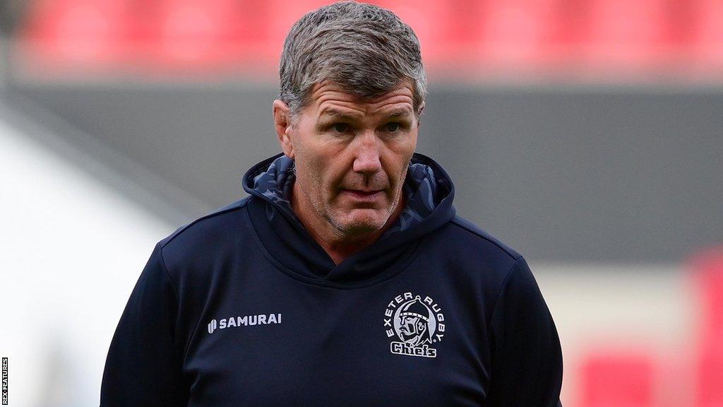 Rob Baxter walks on a rugby pitch