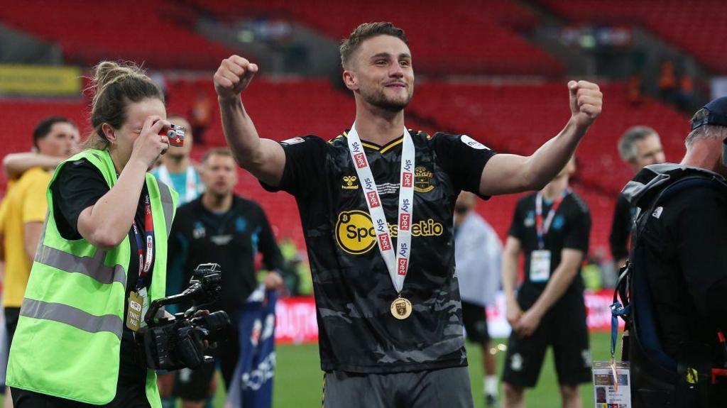 Taylor Harwood-Bellis celebrates Southampton winning the 2024 play-offs