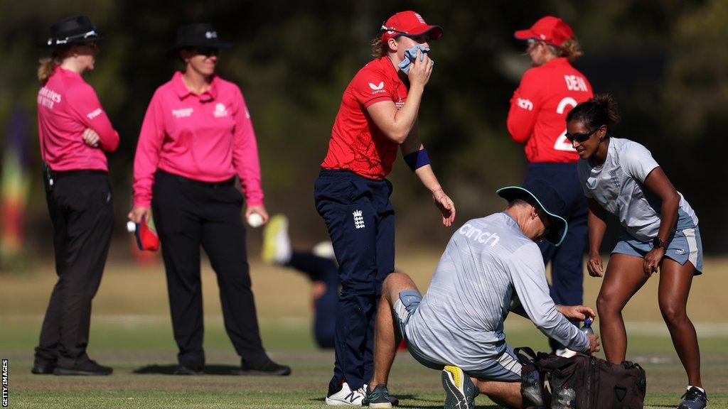 England captain Heather Knight receives treatment after being hit in the face by the ball in their ICC Women's World Cup warm-up match against South Africa