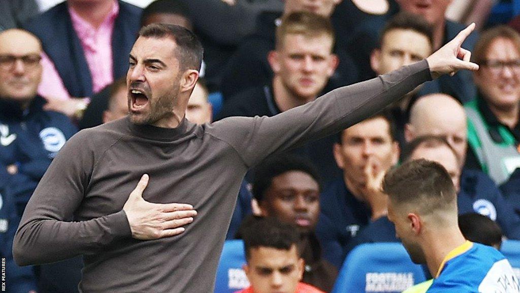 Reading boss Ruben Selles calls instructions to his players on the pitch from the touchline.