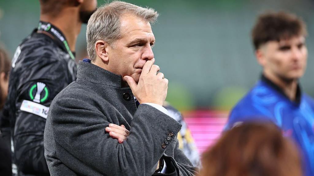 Todd Boehly looks on thoughtfully