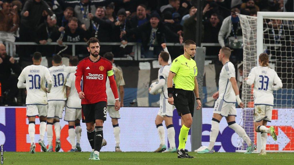 Bruno Fernandes looks downbeat as FC Copenhagen players celebrate behind him