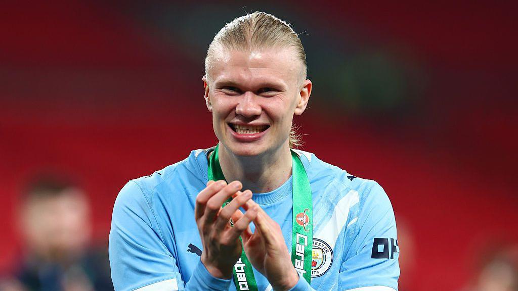 Erling Haaland celebrates winning the Carabao Cup with Manchester City