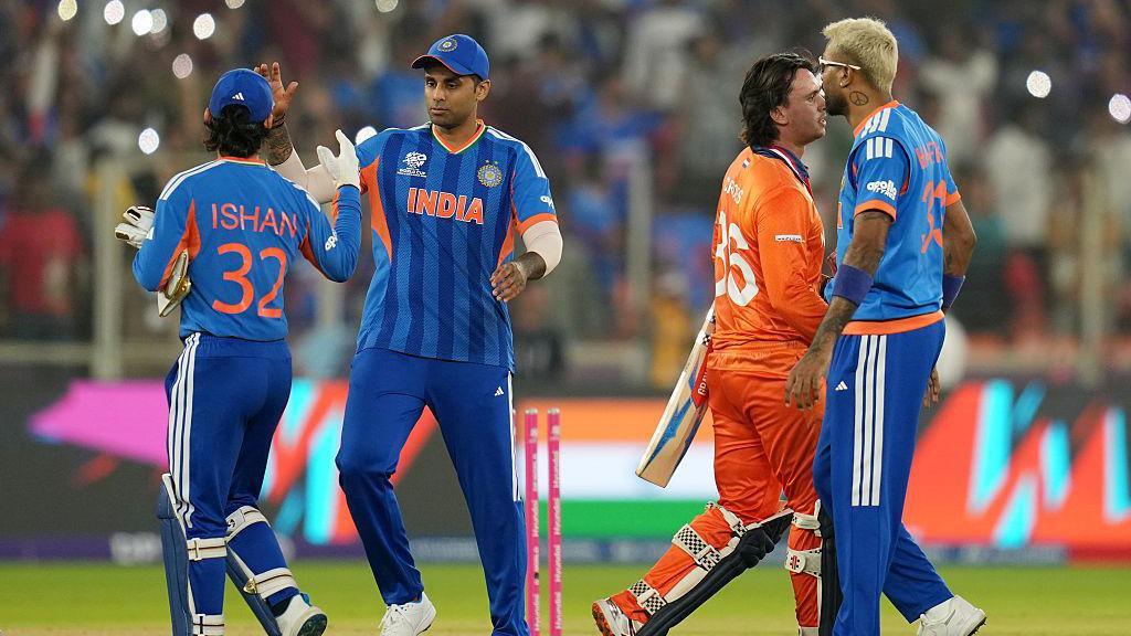 India celebrate after completing four wins out of four in the T20 World Cup group stage