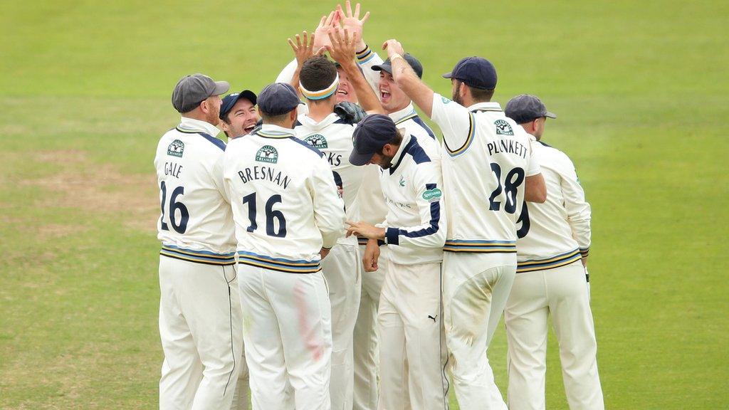 Yorkshire players celebrate the fall of the first Lancashire wicket in the Roses match at Headingley