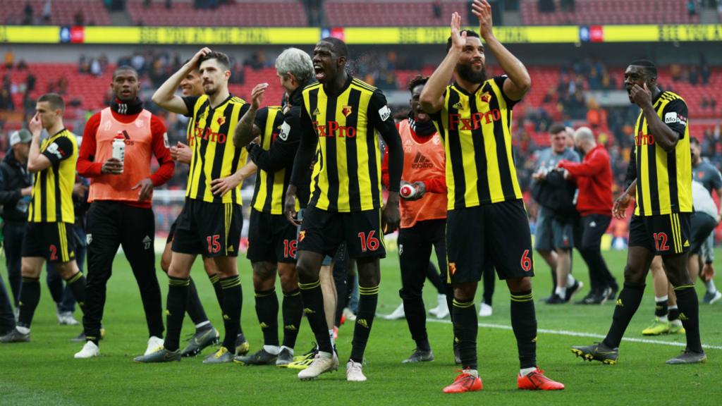 Watford players applaud their fans at full-time