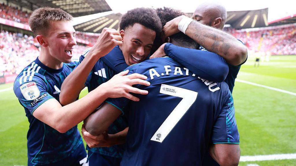Leicester players celebrate with goalscorer Abdul Fatawu at The Valley