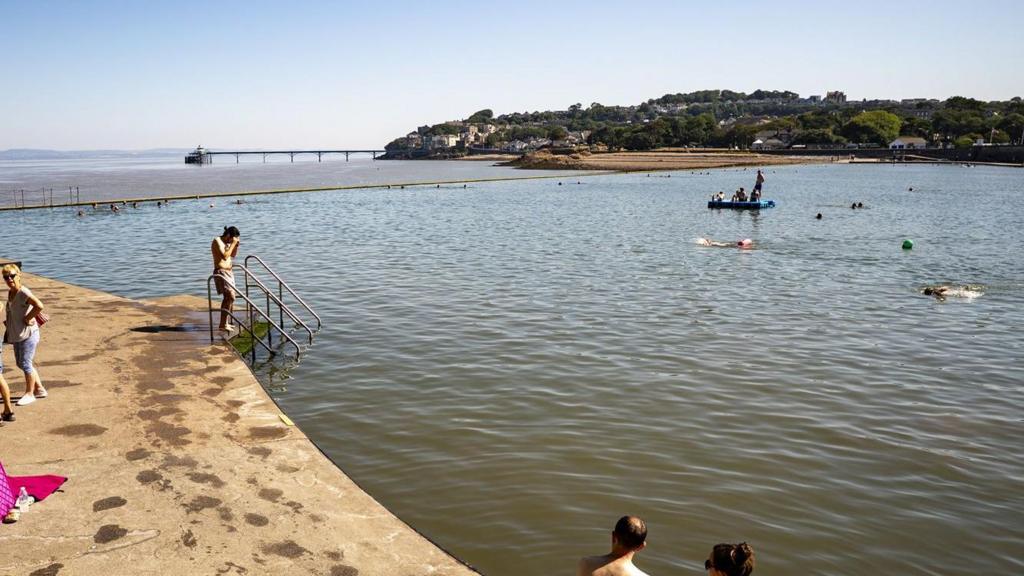 People entering or sitting Clevedon Marine Lake