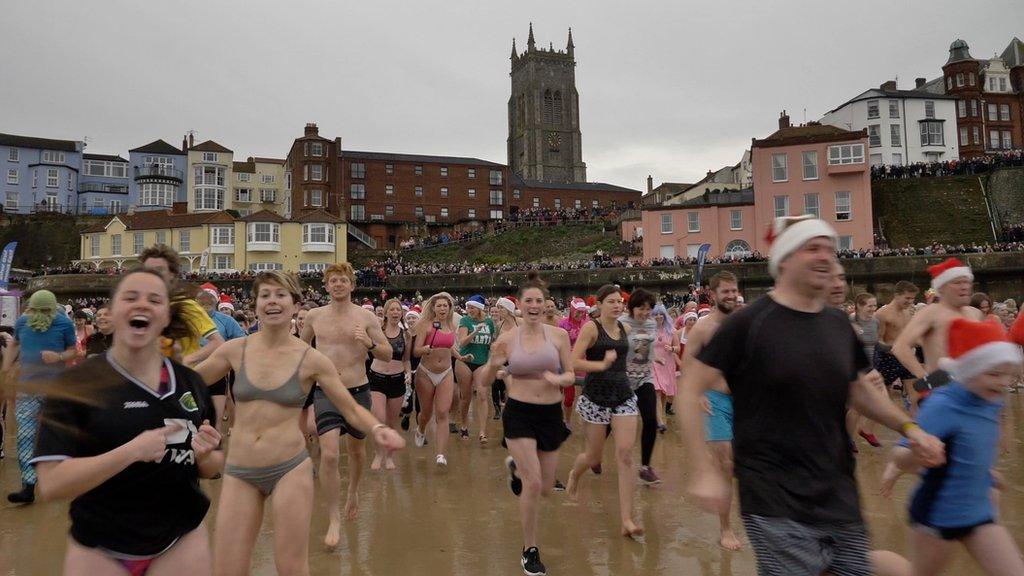 Cromer dippers run towards the North Sea