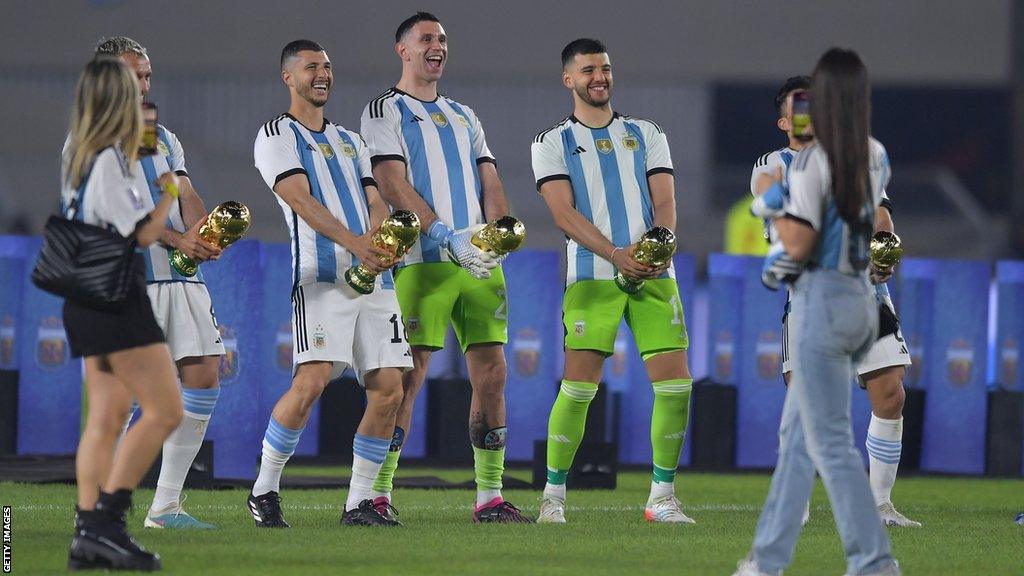 German Pezzella, Guido Rodriguez, Emiliano Martinez, Geronimo Rulli, Marcos Acuna recreate Martinez's World Cup trophy celebration