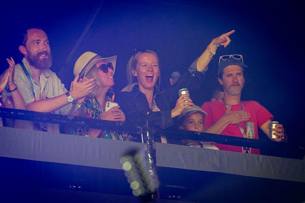 Emily Eavis punches the sky as she watches CMAT perform on Glastonbury's Pyramid Stage