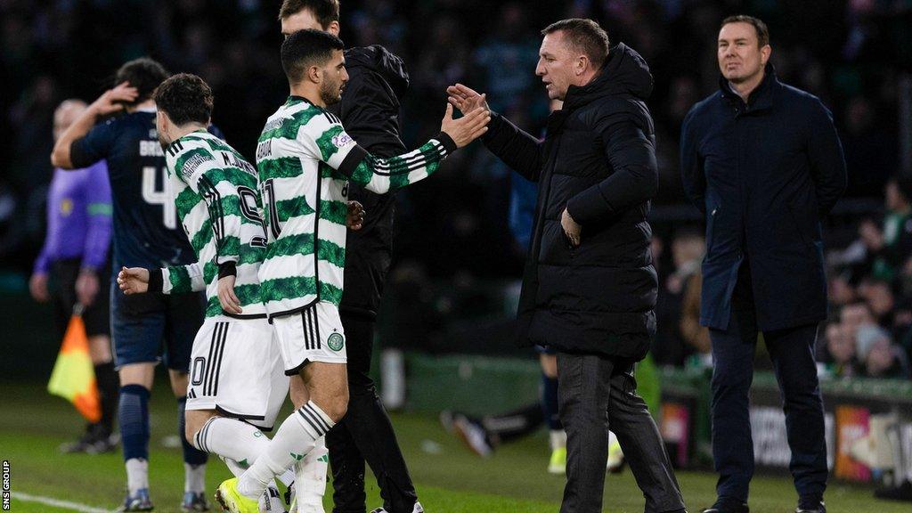 Celtic's Liel Abada shakes hands with Brendan Rodgers during a cinch Premiership match between Celtic and Ross County at Celtic Park