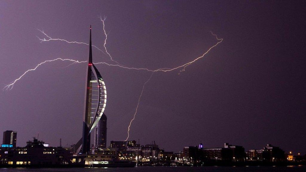 Lightning flashes near the Spinnaker Tower in Portsmouth.