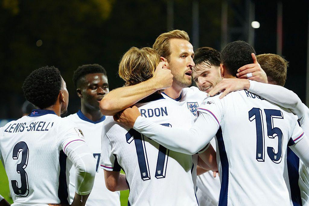England celebrating a goal against Latvia