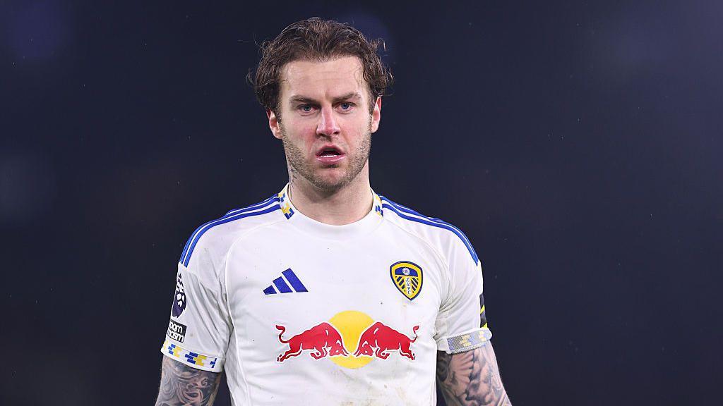 Joe Rodon in action wearing a white Leeds United shirt