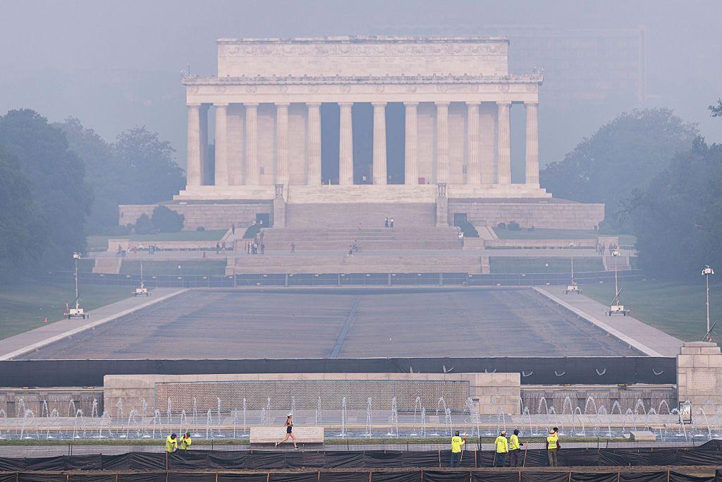 Smoke from massive wildfires in Canada and Minnesota engulf the Washington, D.C. skyline, reducing visibility and casting a colored haze over the Lincoln Memorial.