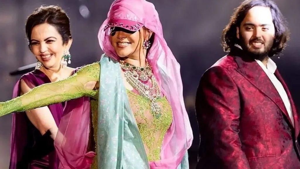 Rihanna seen performing at a pre-wedding event for the Ambanis with Nita Ambani (left) and Anant Ambani (right)