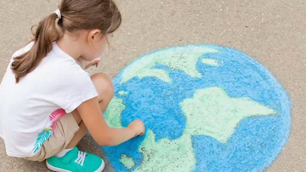 Girl drawing the world