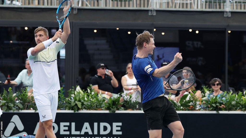 Lloyd Glasspool (L) and Harri Heliovaara (R) celebrate winning the Adelaide International doubles title