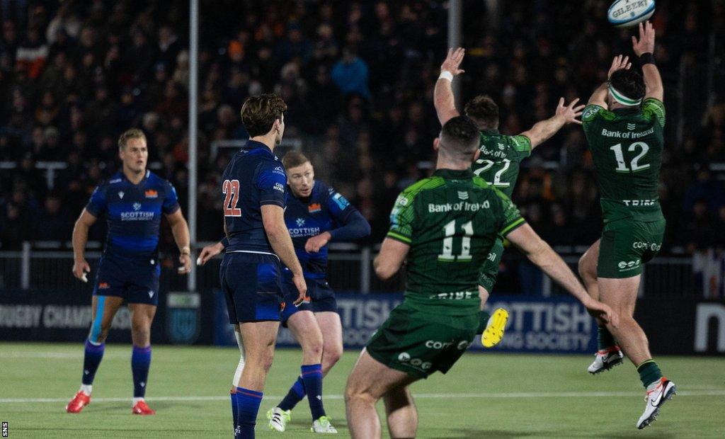 Edinburgh's Ben Healy (centre) scores the winning drop goal