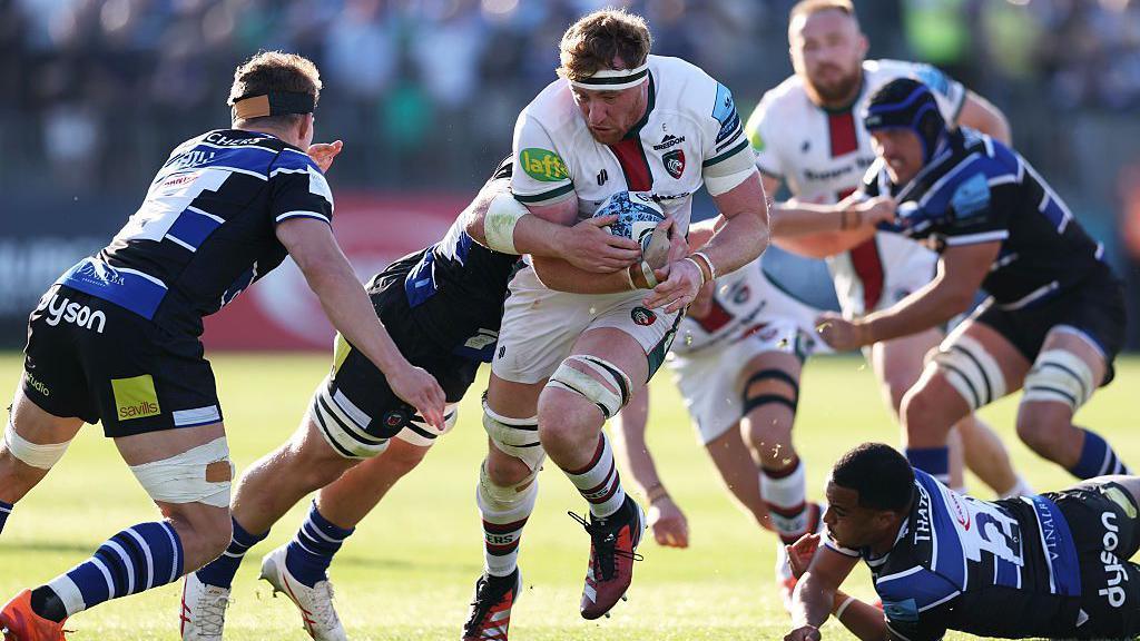 Leicester's Ollie Chessum is tackled by Bath's Finn Russell 