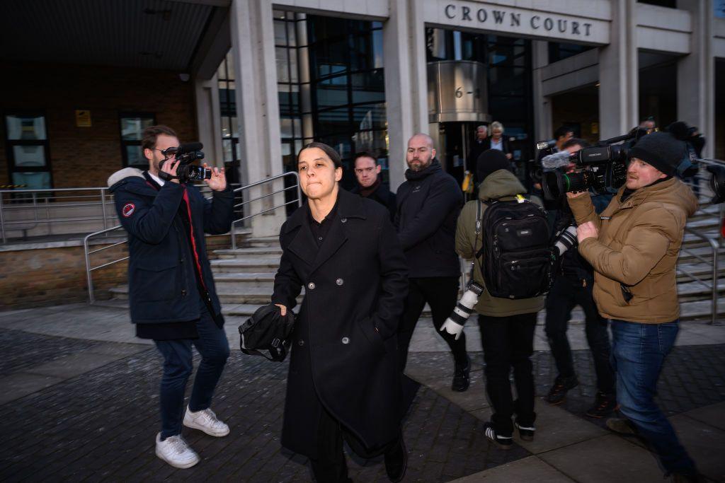 Sam Kerr leaves court during her trial for racially aggrivated harrassment