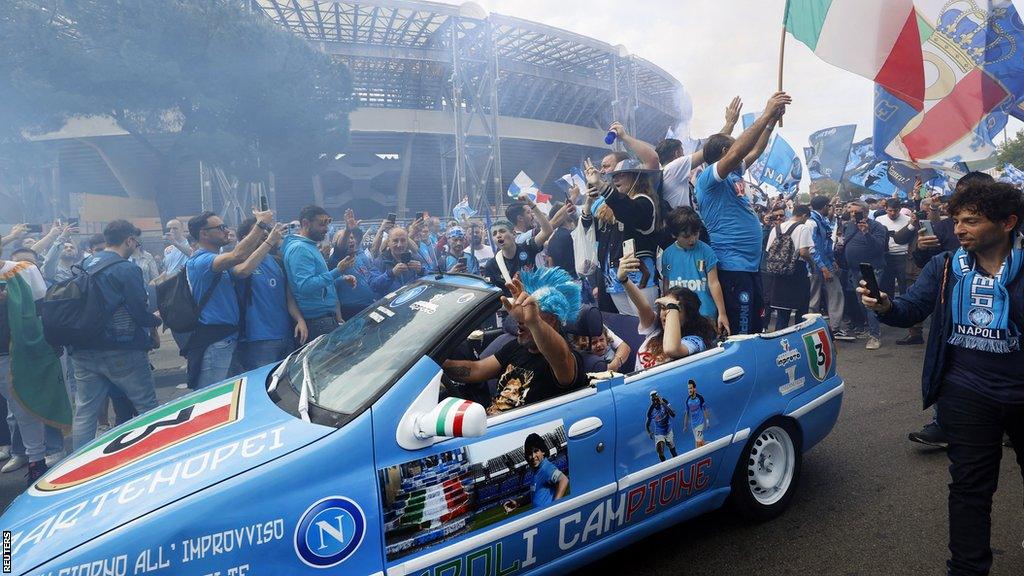 Napoli fans arrive for their Serie A game against Selernitana in a Napoli-branded car