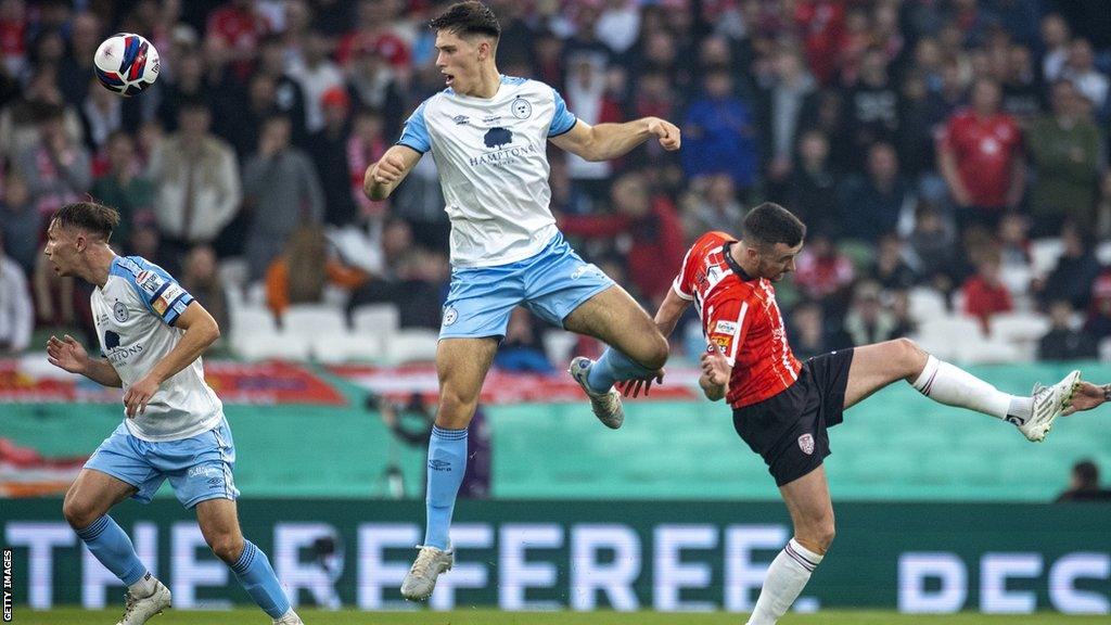 Oxford United have signed Shelbourne FC defender Stephan Negru from Ireland's top flight.