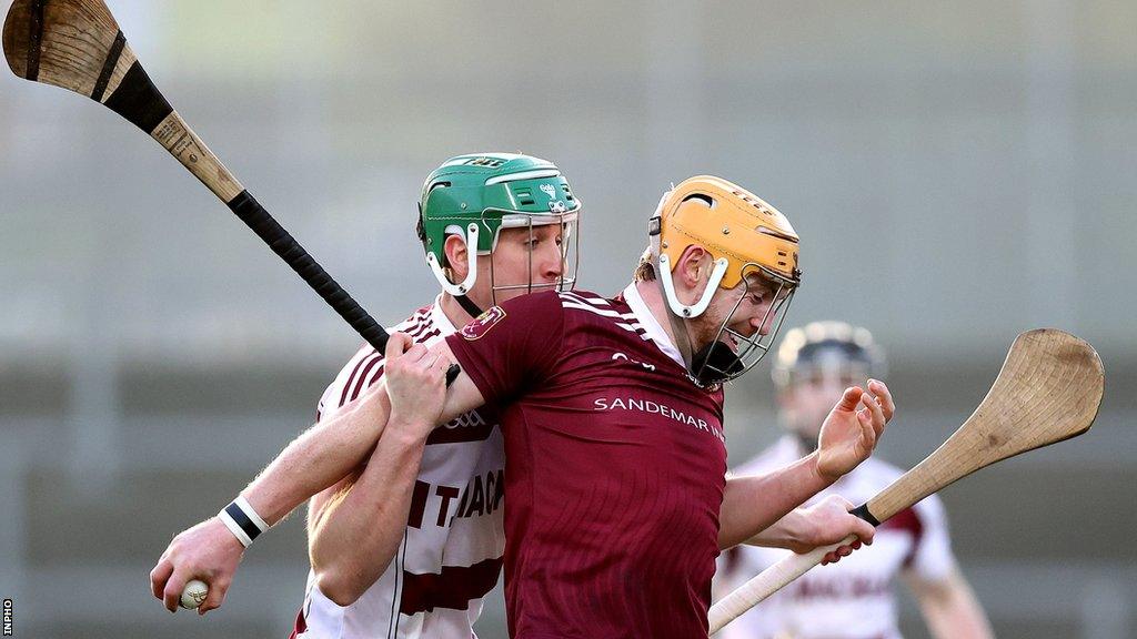 Slaughtneil's Shane McGuigan gets to grips with Cushendall's Ryan McCambridge at Pairc Esler