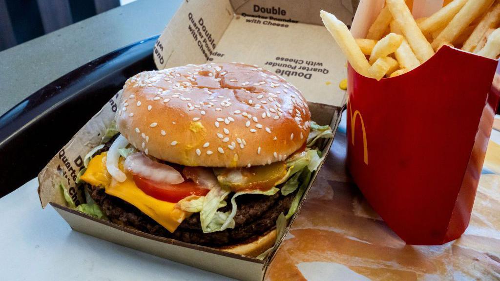 A double quarter pounder with cheese and fries arranged at a McDonald's restaurant in El Sobrante, California, US.