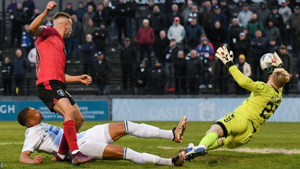 Queen's Park's Connor Shields is denied by Ayr United goalkeeper Charlie Albinson