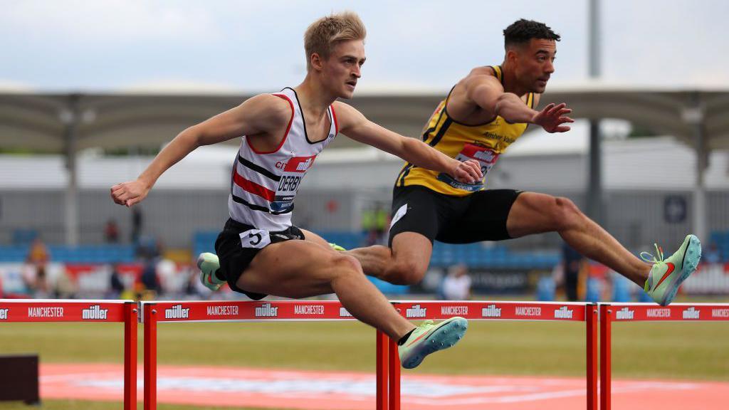 Seamus Derbyshire in full stride moves over the hurdles in a 400m hurdles race