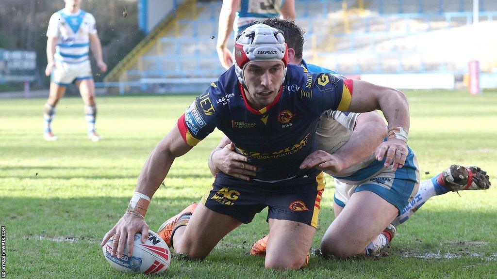 Cesar Rouge scoring a try for Catalans Dragons away to Halifax