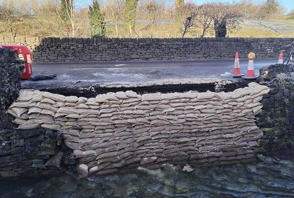 Sandbags at wall collapse site