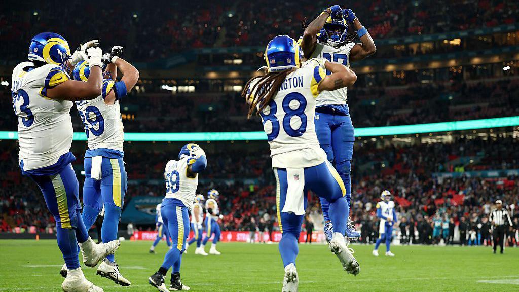 Los Angeles Rams players celebrate a touchdown against the Jacksonville Jaguars at Wembley