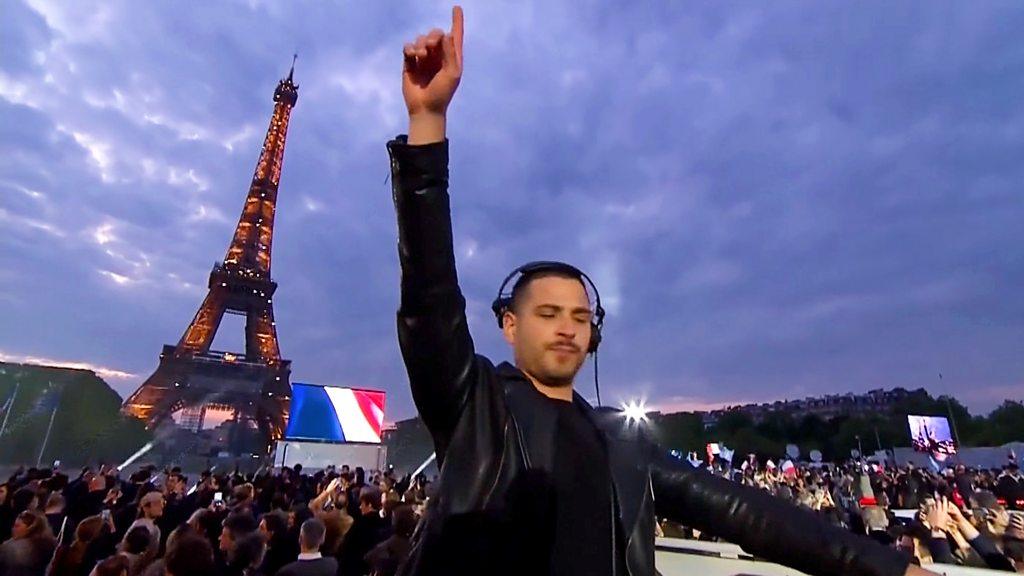 A DJ in front of the Eiffel Tower in Paris