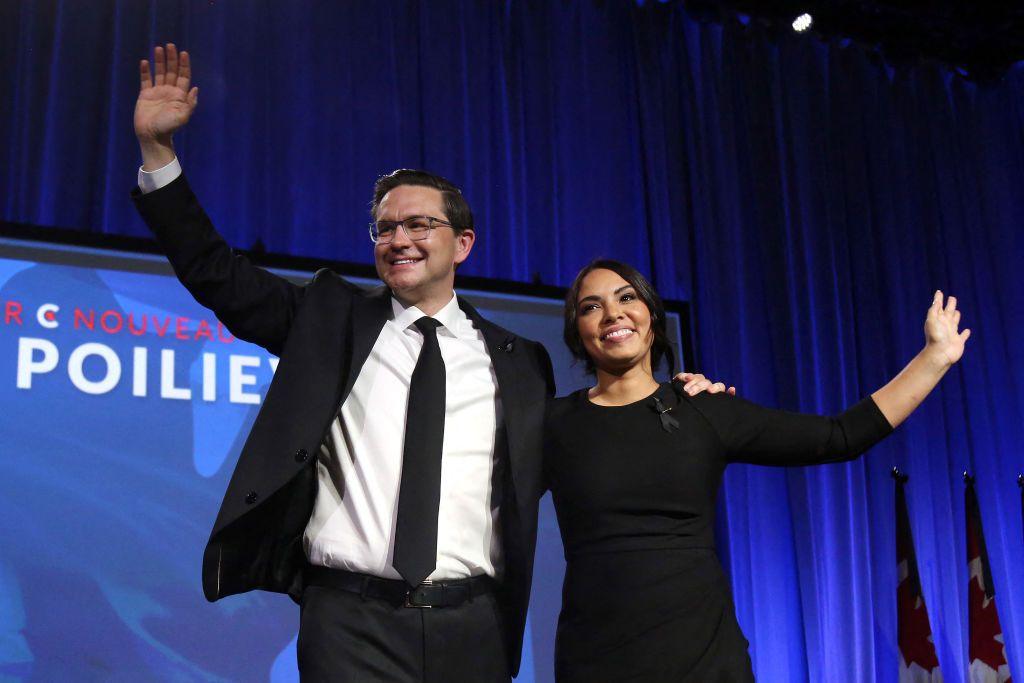 Canada's Conservative Party newly elected leader Pierre Poilievre (L) and his wife Anaida wave to supporters during the Conservative Party Convention at the Shaw Centre, Ottawa, Canada on September 10, 2022.