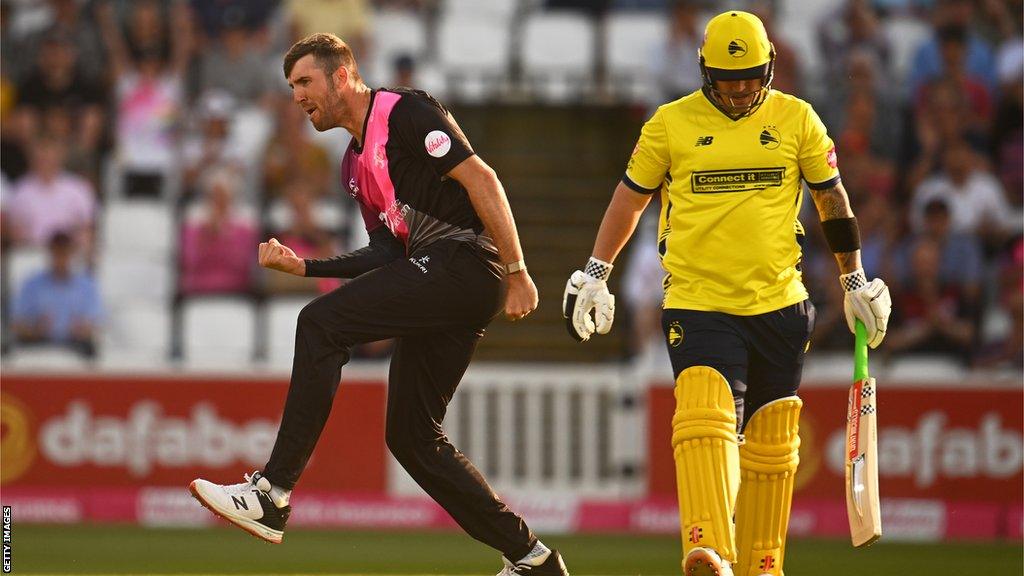 Craig Overton celebrates a wicket