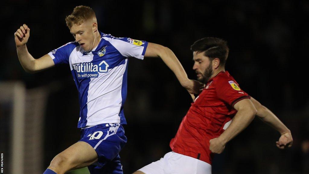 Cian Harries tackles Josh Coburn of Bristol Rovers