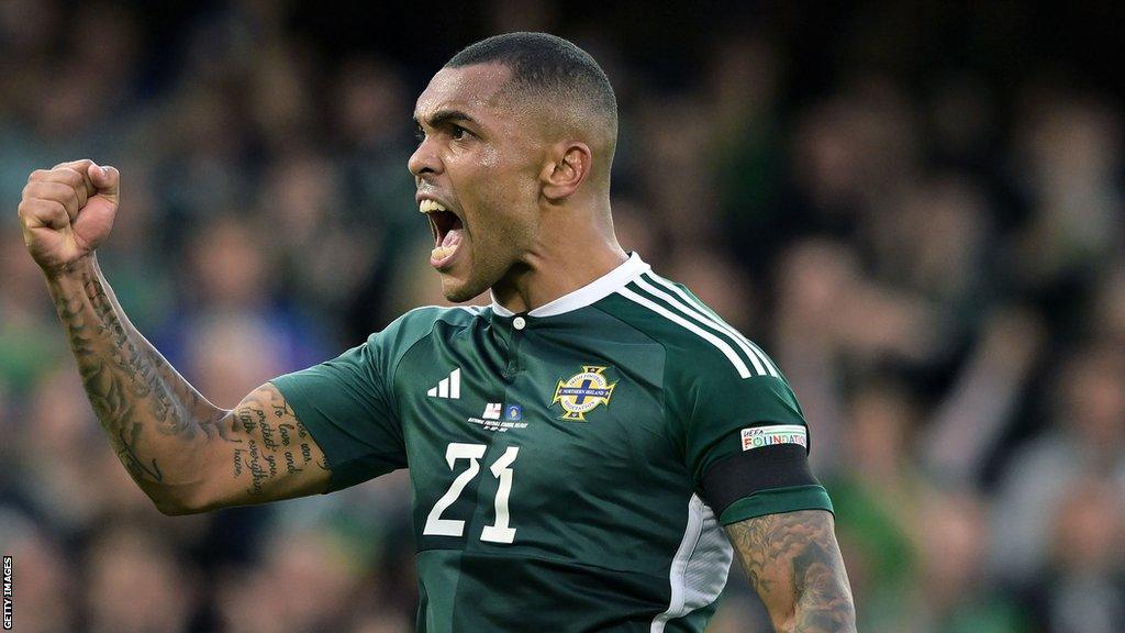 Josh Magennis celebrates a goal at Windsor Park