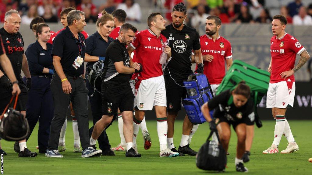 Wrexham's Paul Mullin was able to walk off the field after sustaining his injury