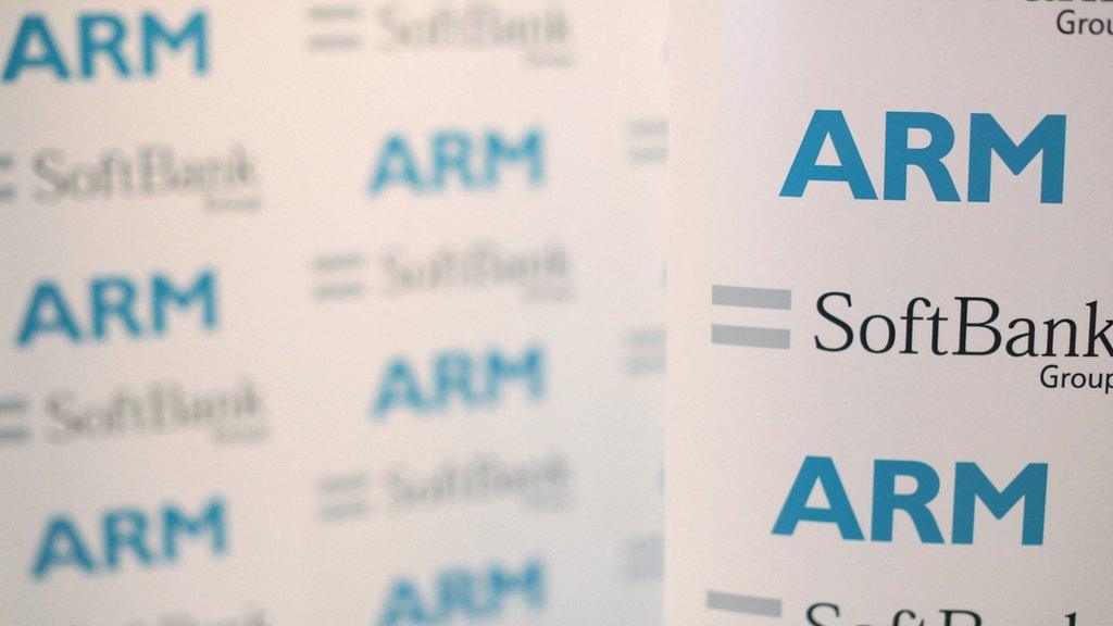 An ARM and SoftBank Group branded board is displayed at a news conference in 2016